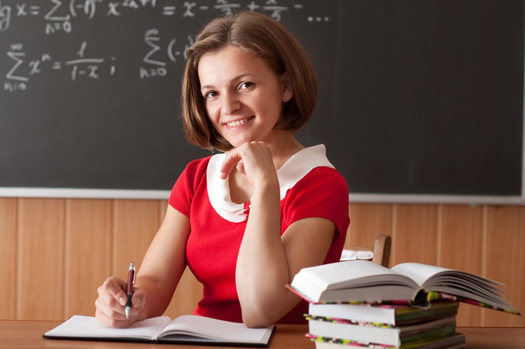 Young teacher is preparing for the lesson
